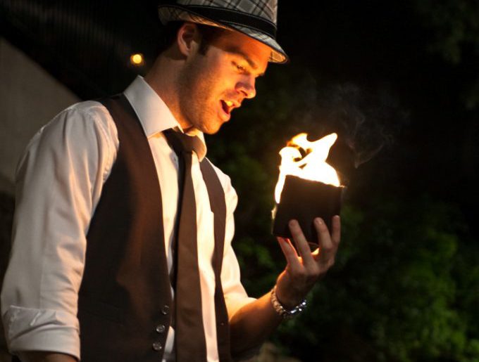 roving magician with cards and fire