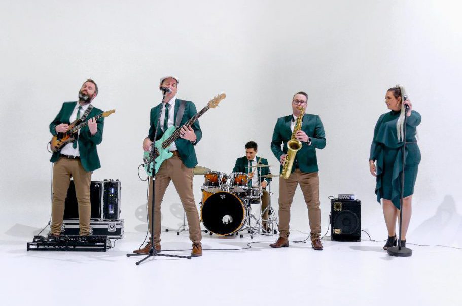 5 piece Brisbane band "Groove Elements" playing in a photo studio with a white backdrop.