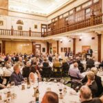 Corporate function in Brisbane with guest speaker and formal dinner setting.