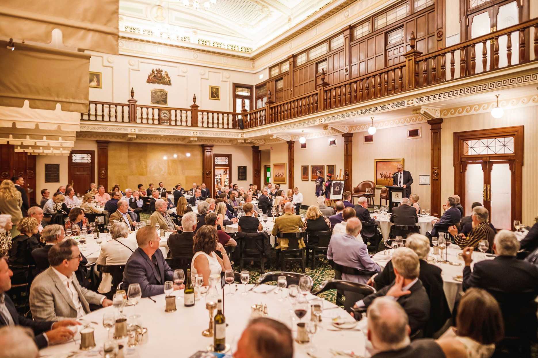 Corporate function in Brisbane with guest speaker and formal dinner setting.