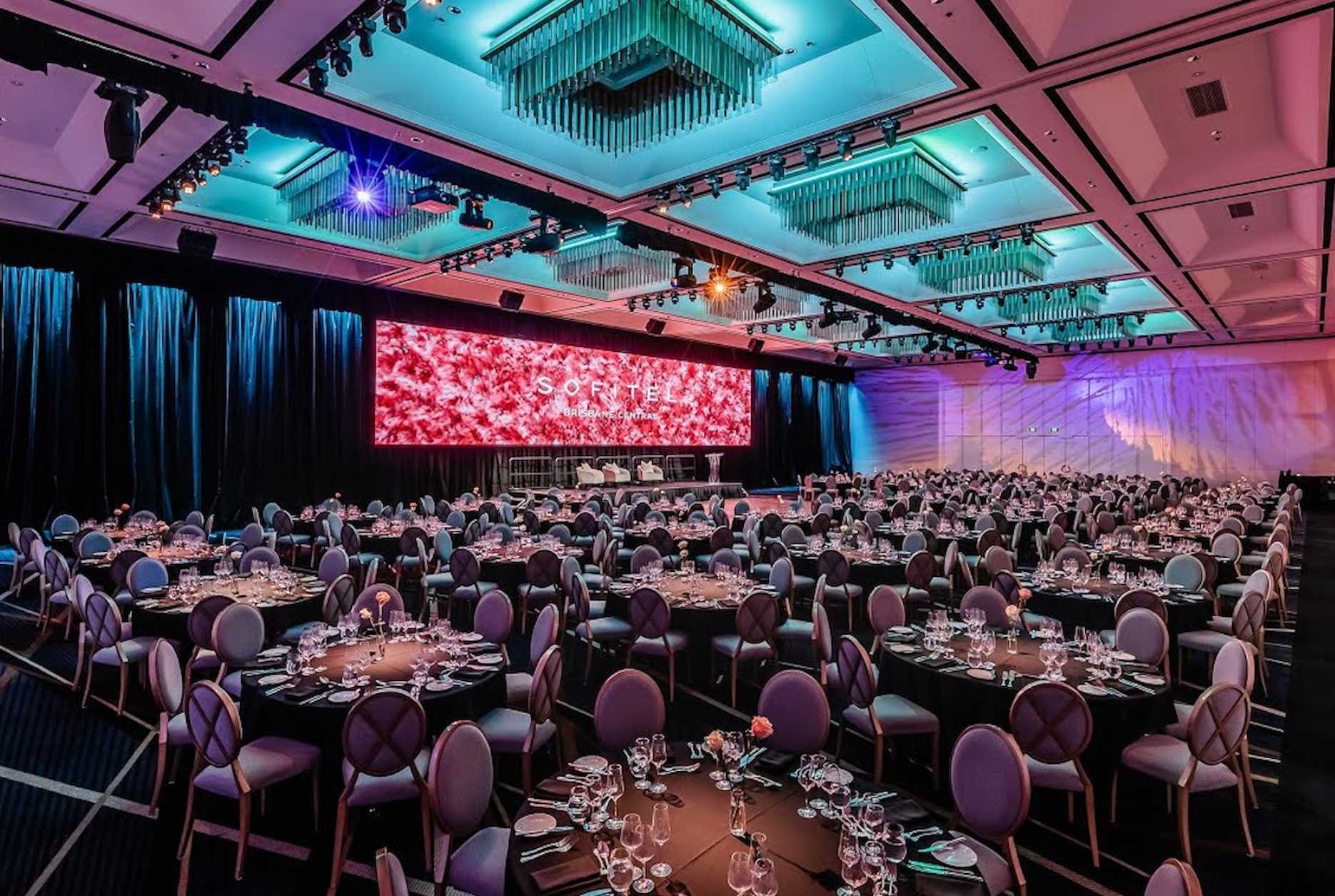 Sofitel Brisbane Central ballroom set up for a corporate gala dinner.