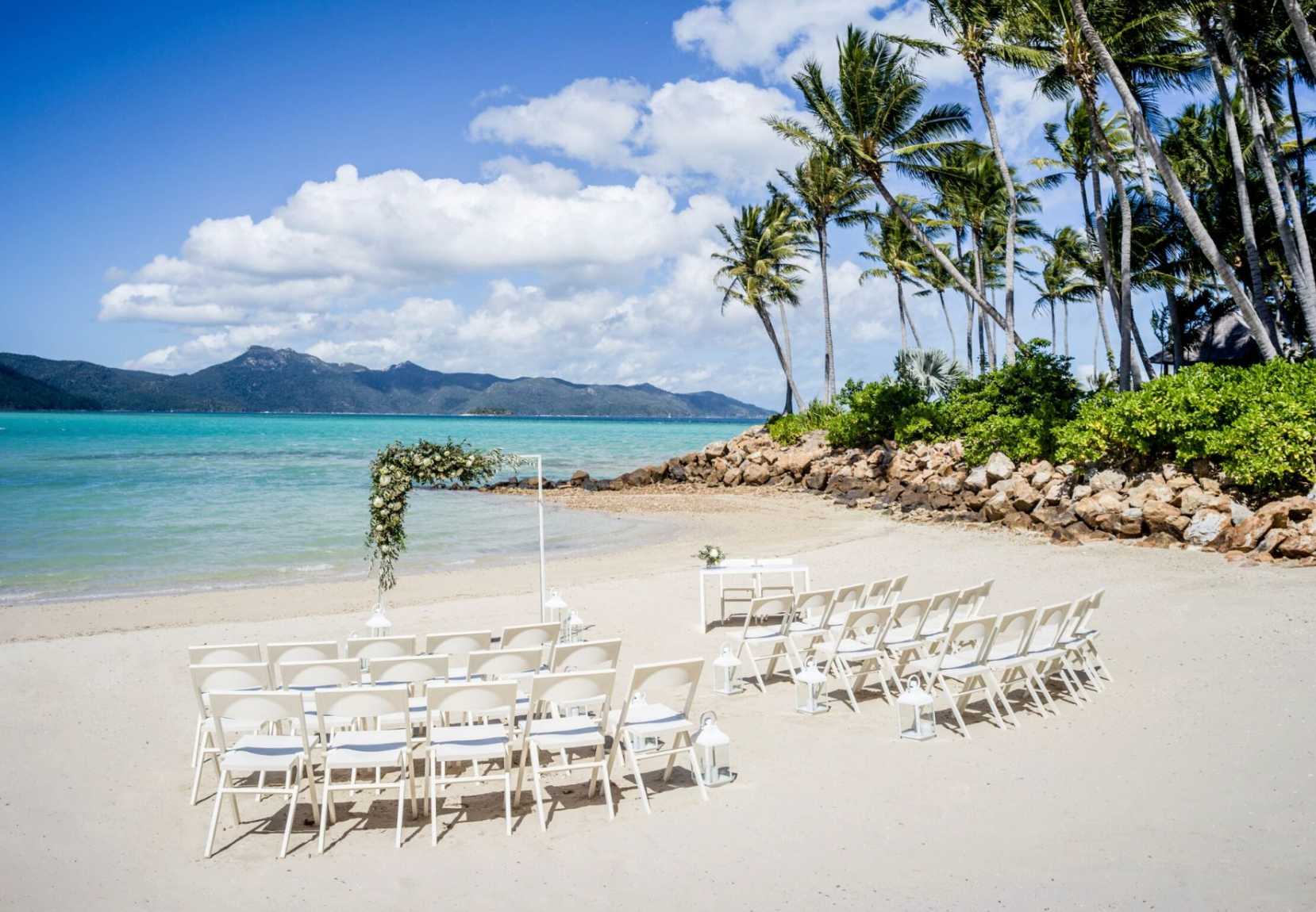 InterContinental Hayman Great Barrier Reef wedding venue with beach ceremony setup and tropical ocean views.