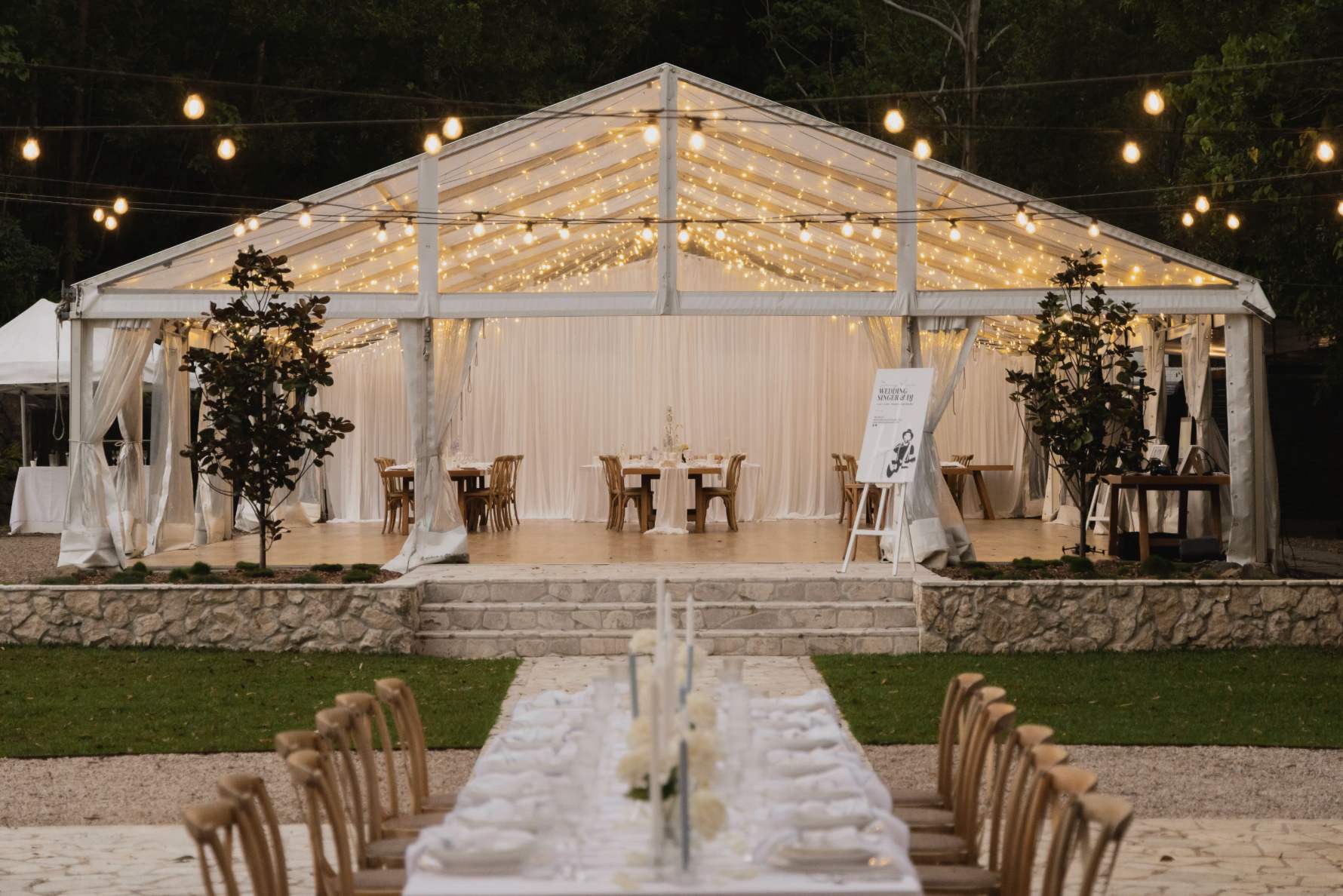 Australian wedding venue with outdoor marquee reception, long table styling and warm fairy lights.
