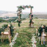 An altar and aisle setup for a wedding in the country.