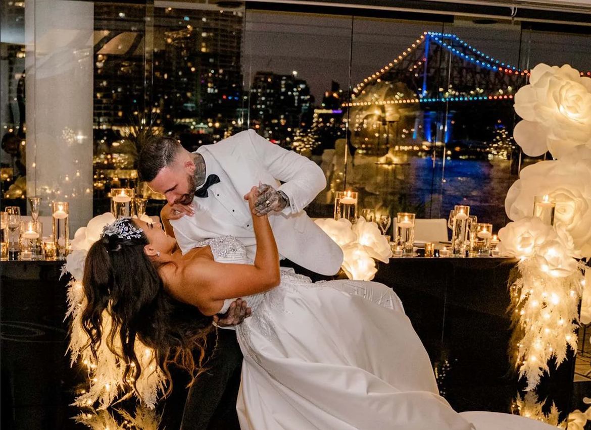 Wedding couple dancing at Blackbird Brisbane with Story Bridge, Brisbane River views and candlelit reception styling.