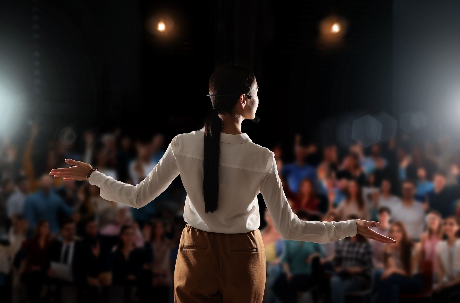 Keynote speaker addressing an audience at a corporate conference.