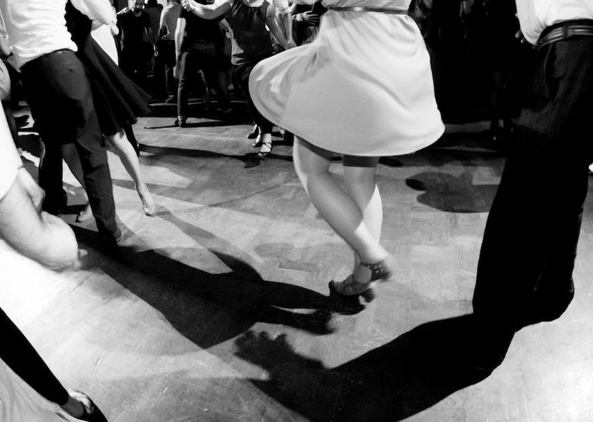 A Group of guests dancing at wedding.