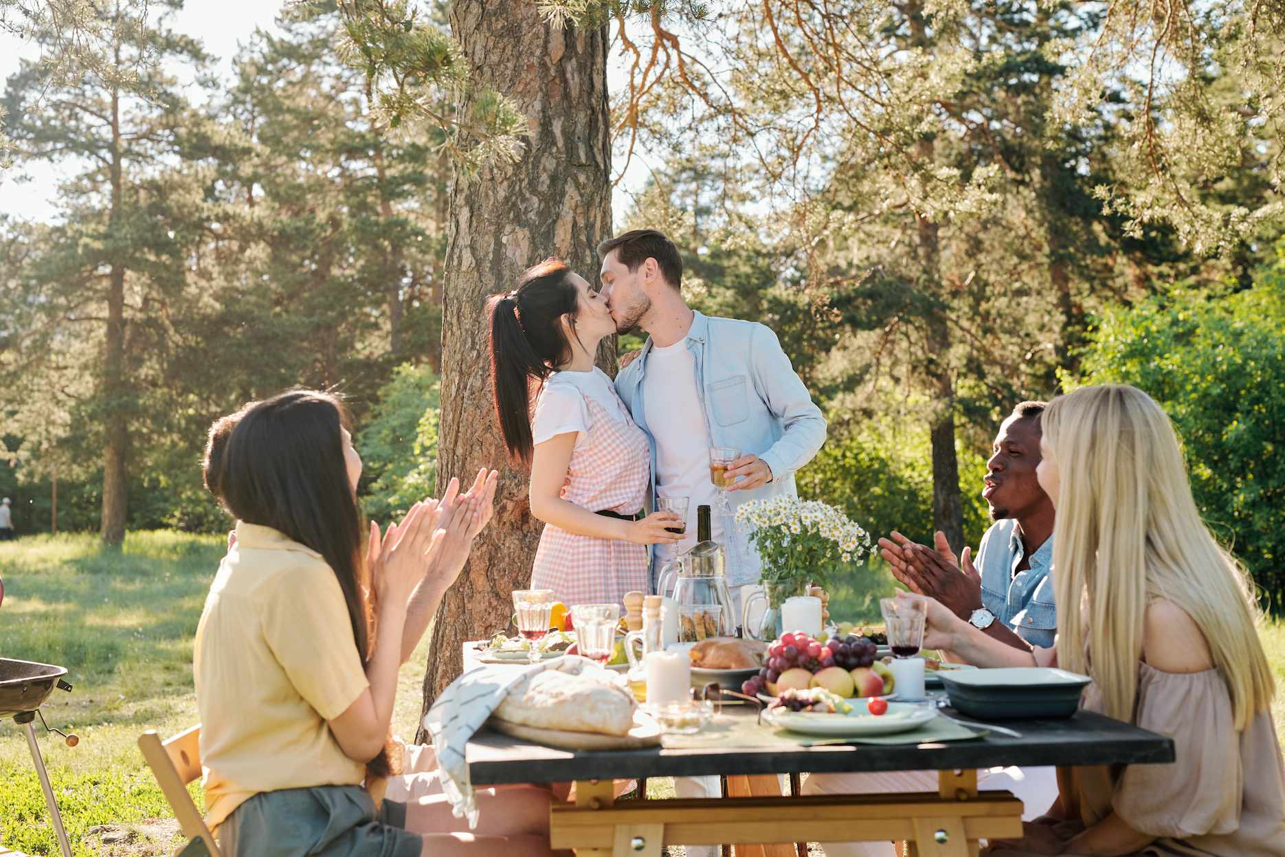A low-budget, low-key engagement party in the park with close friends.
