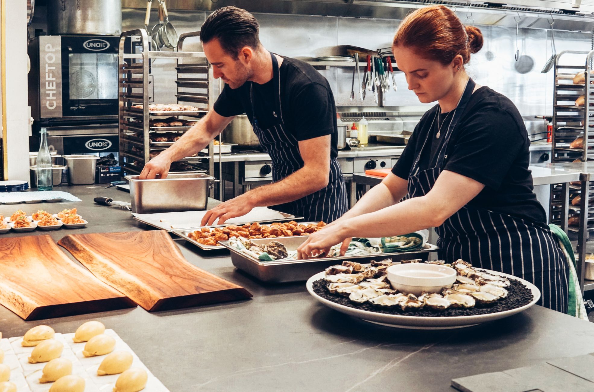 Catering Staff Working In Kitchen