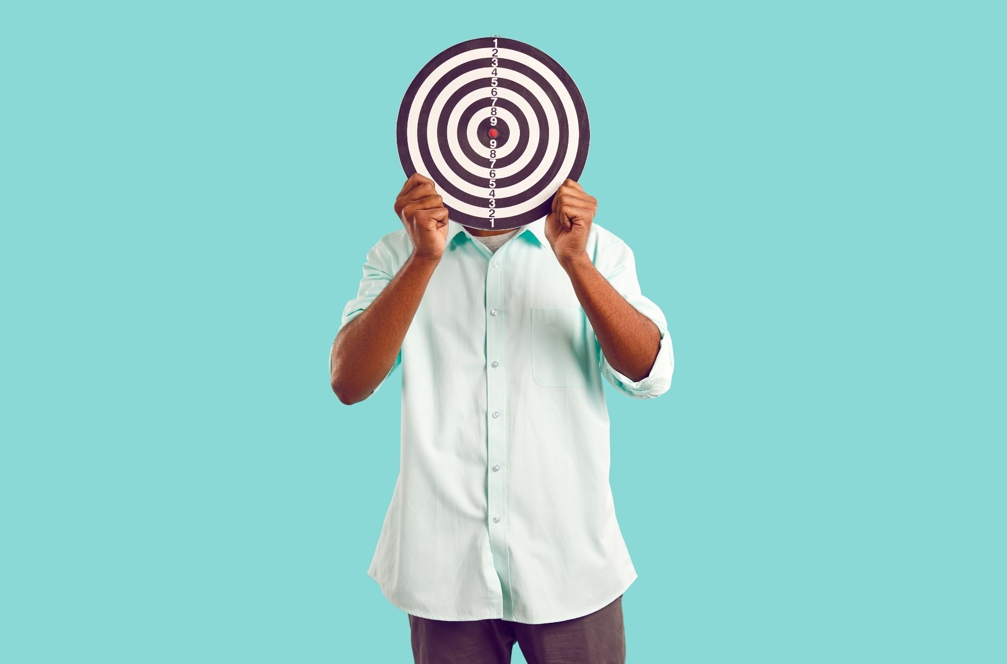 Man Holding Target Board Over Face