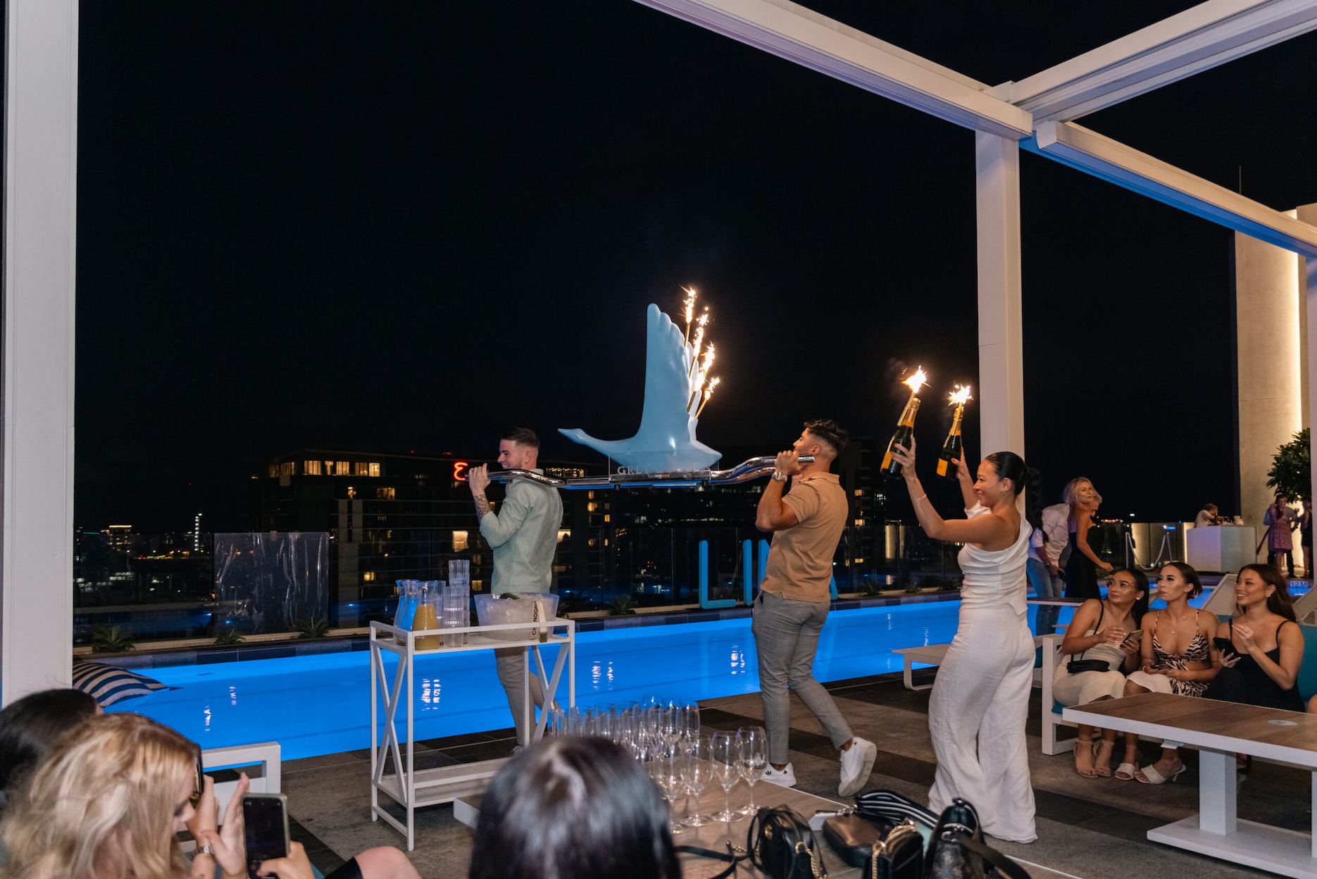 People enjoying a birthday at Lina Rooftop.