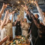 People throwing confetti at a work Christmas party.