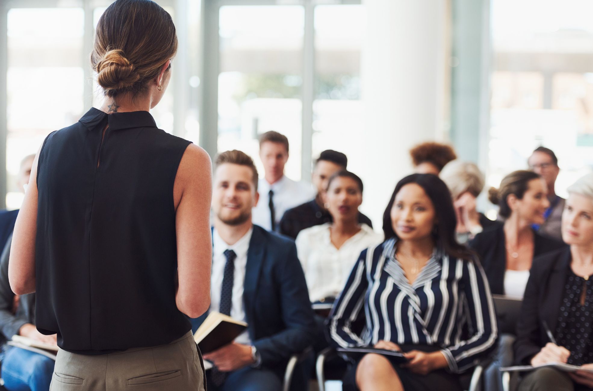 Female MC Speaking At Corporate Event