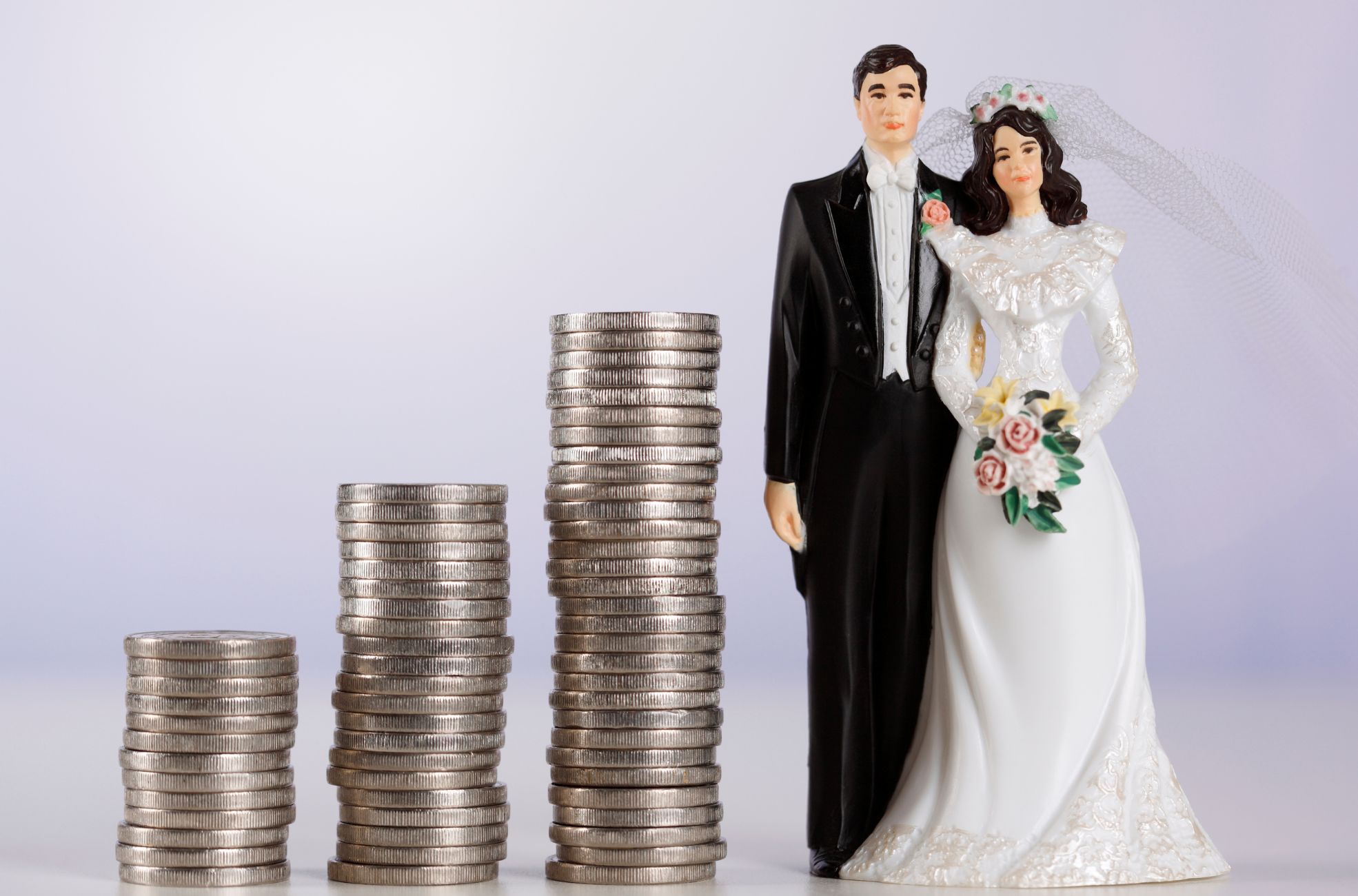 Bride And Groom Next To Pile Of Coins