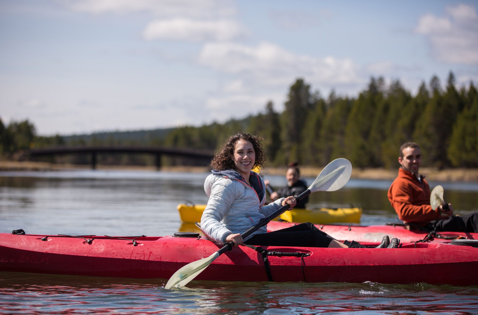 People Kayaking On River