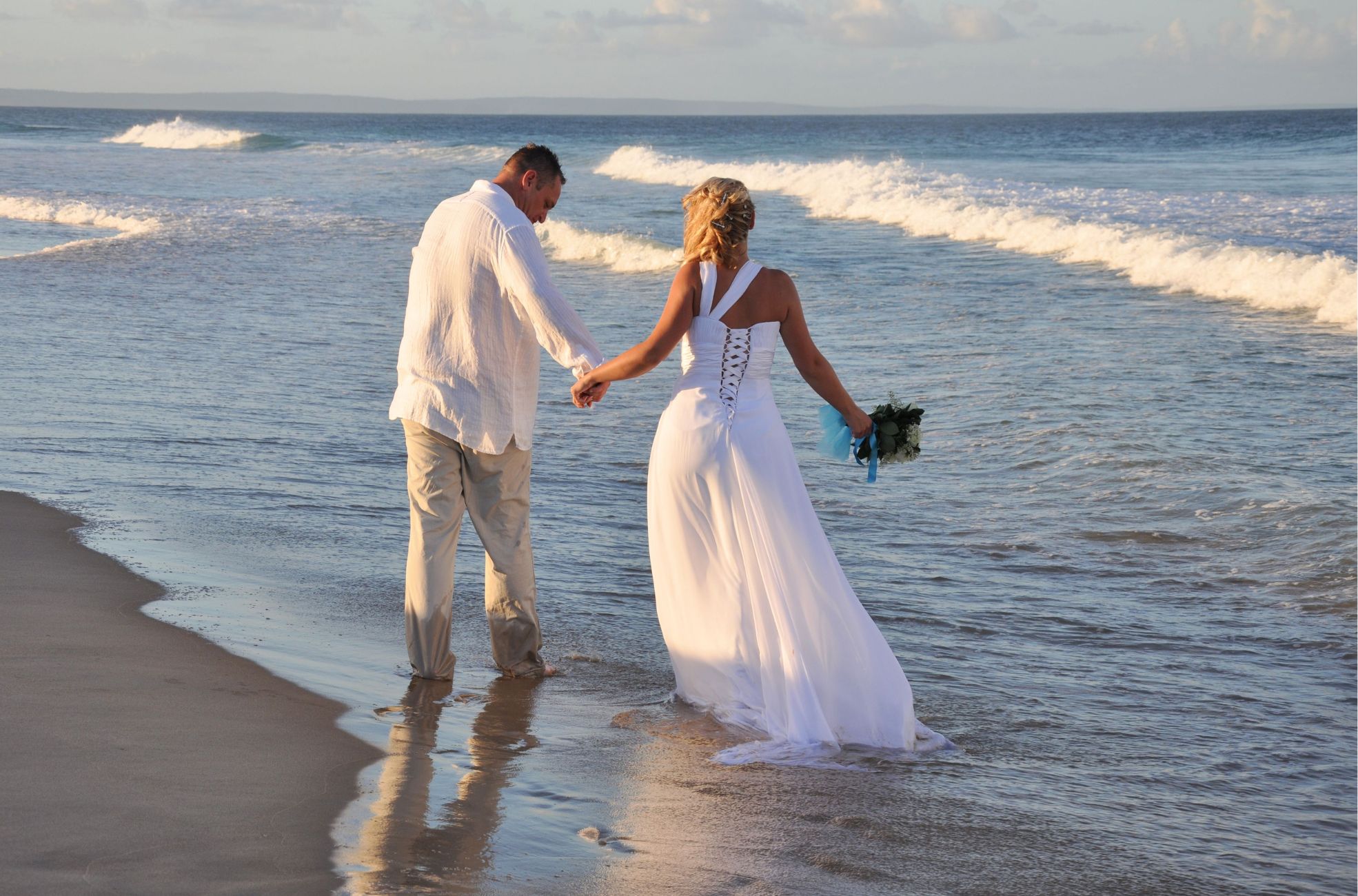 Wedding Couple Walking On Beach