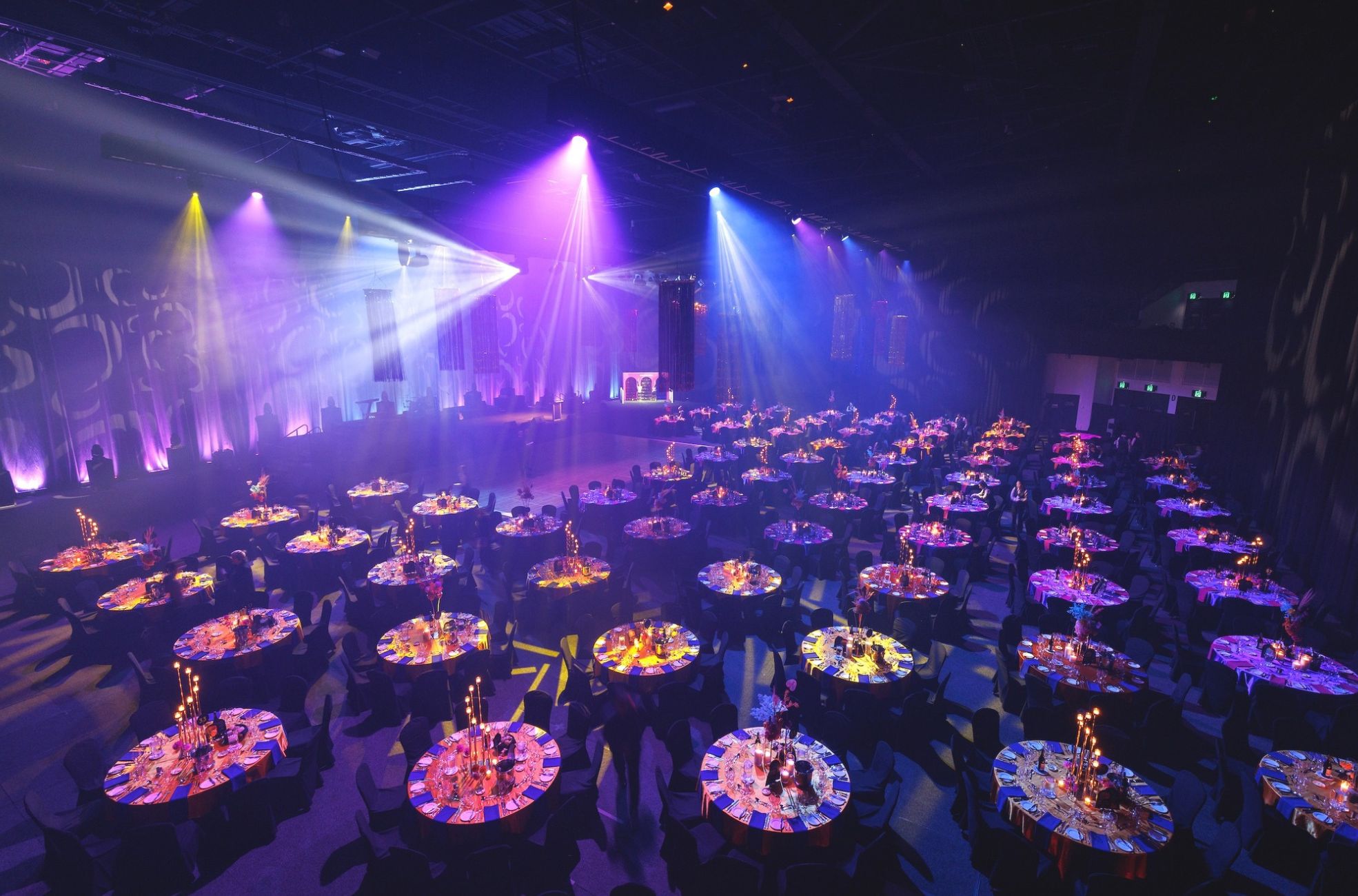 gold-coast-convention-and-exhibition-centre Corporate gala dinner on the Gold Coast with banquet tables, stage lighting and event production.