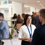 Corporate guests networking at a professional business event.