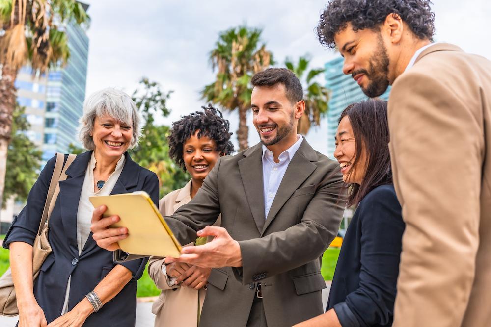 Group of colleagues engaging in a scavenger hunt which is a great audience participation game