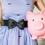 Woman Holding Piggy Bank