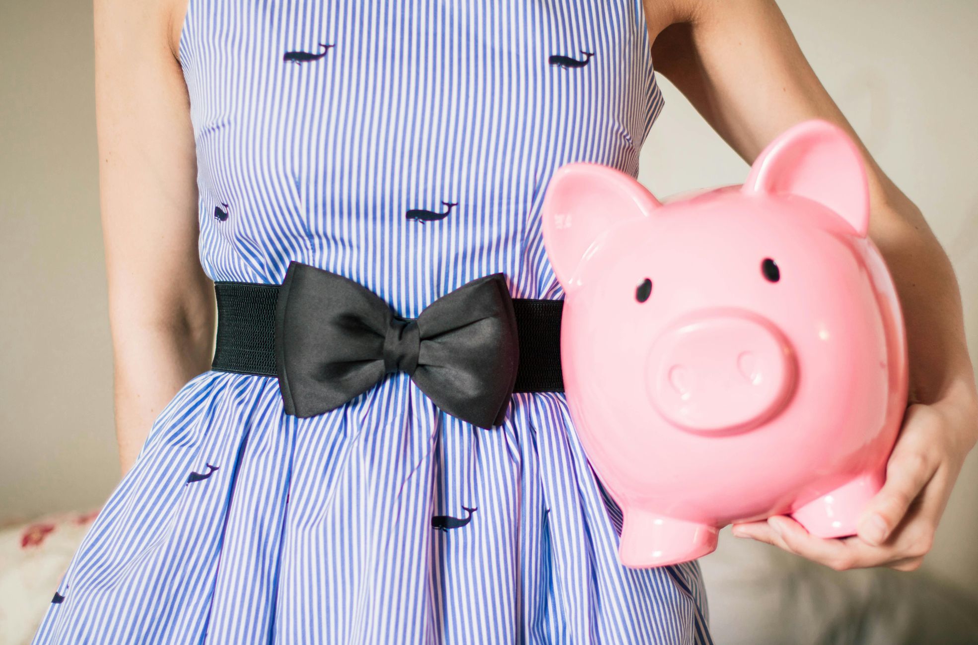 Woman Holding Piggy Bank