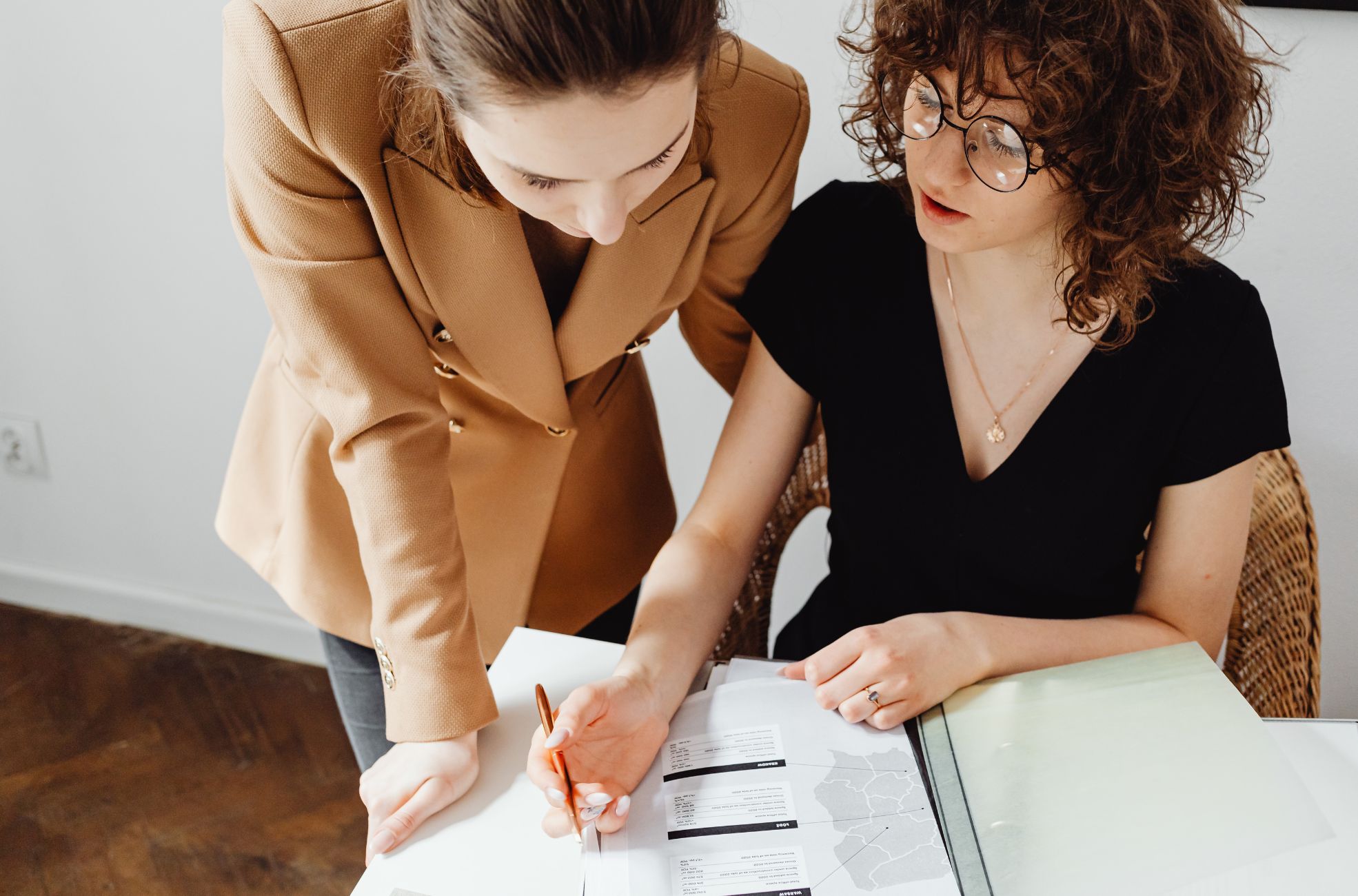Two Women At Desk