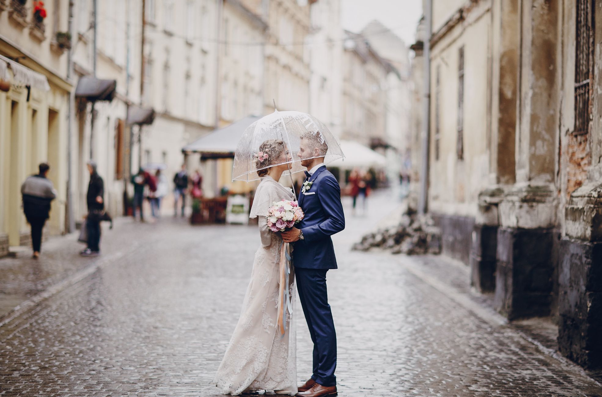 Wedding Couple Kissing In The Rain