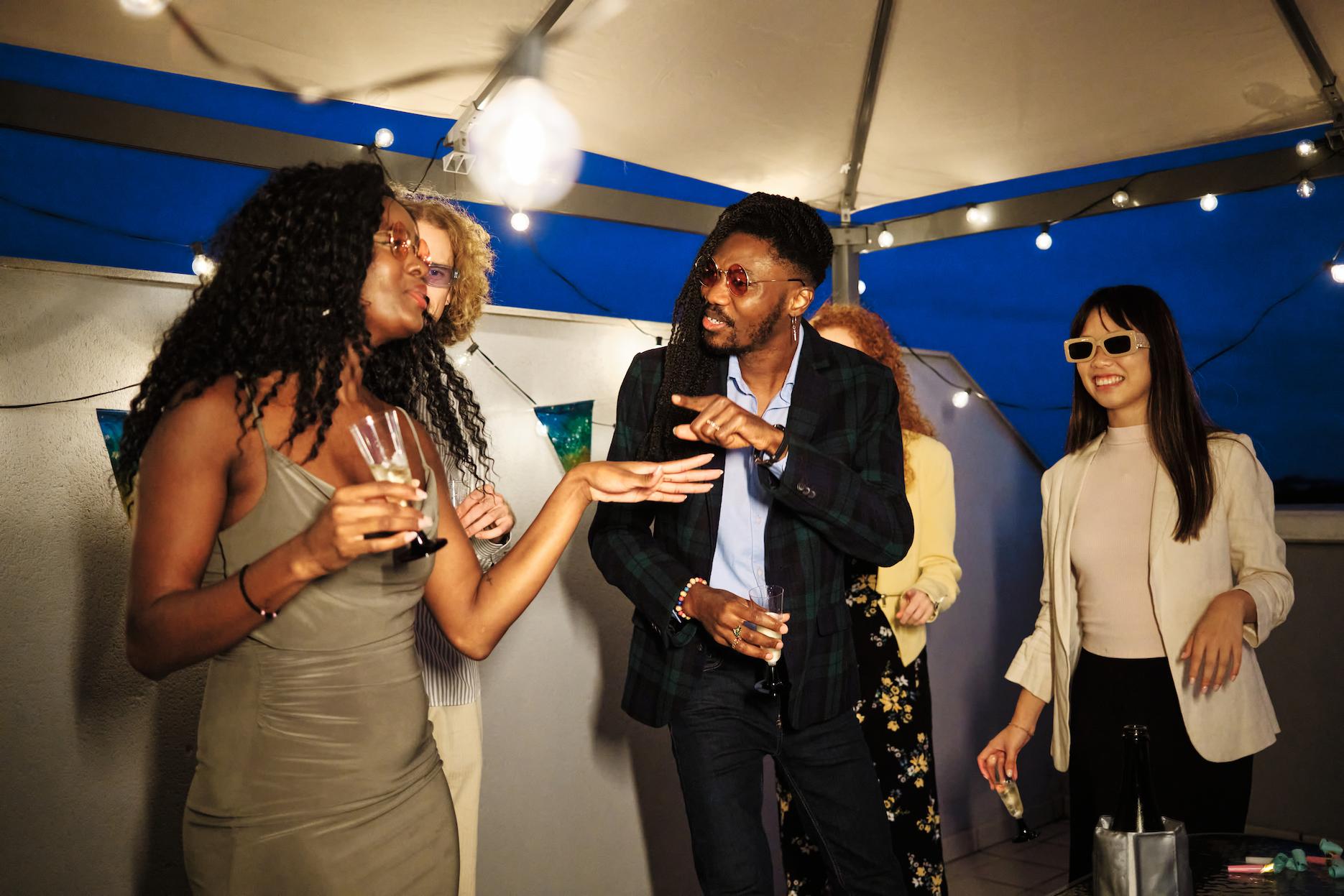 Friends gathering around to celebrate a 21st birthday on a rooftop in Brisbane.