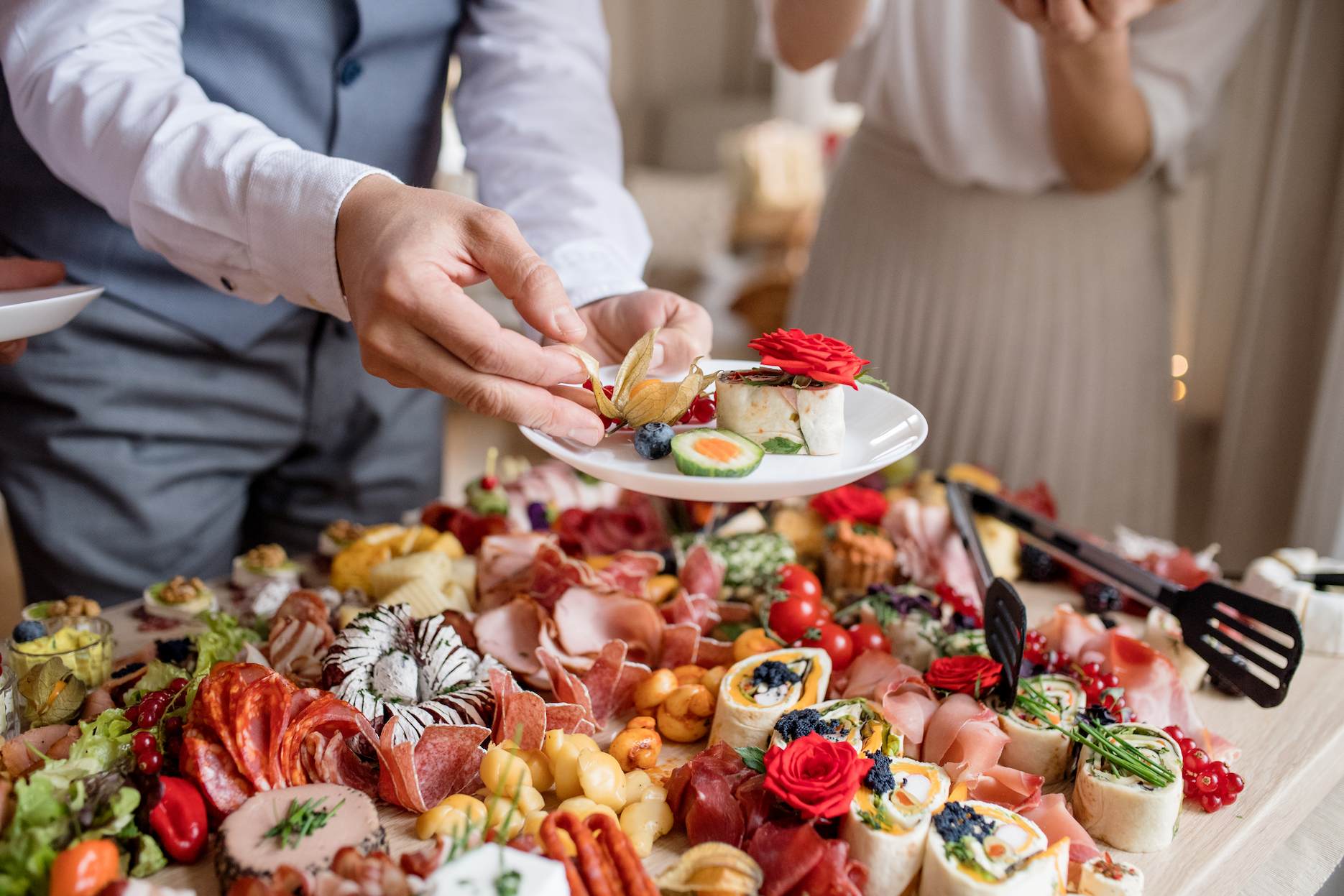 Grazing table with canapés and shared food for engagement party food ideas at a stylish celebration.