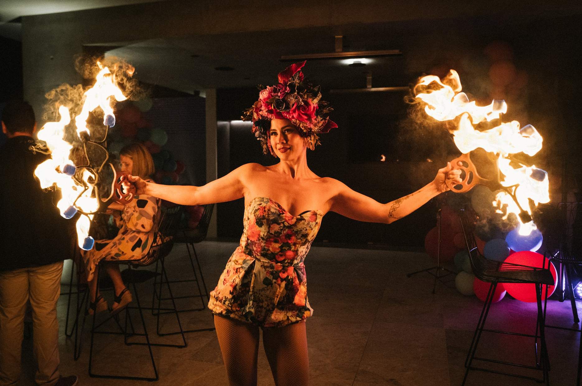 Fire performer entertaining guests at a surprise 40th birthday party with a feature act.