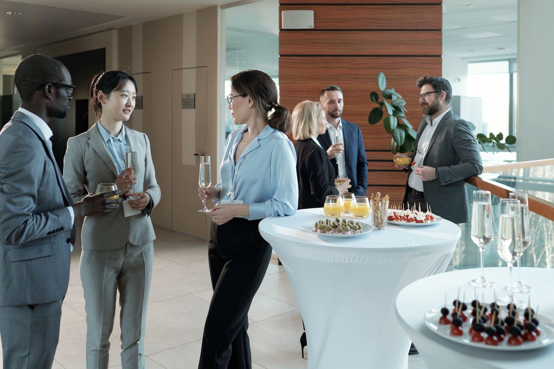 Corporate guests networking at a client appreciation cocktail reception.