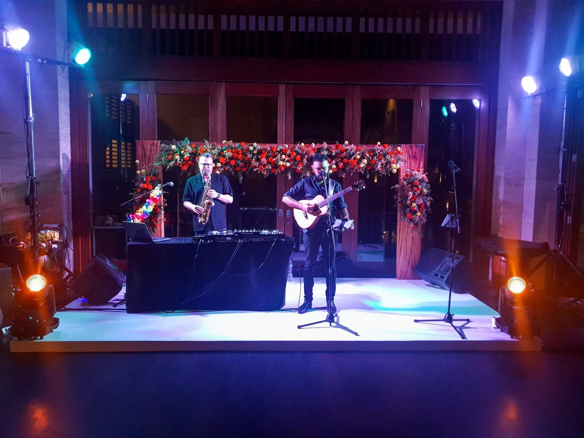 Live musicians performing at a corporate client appreciation event.
