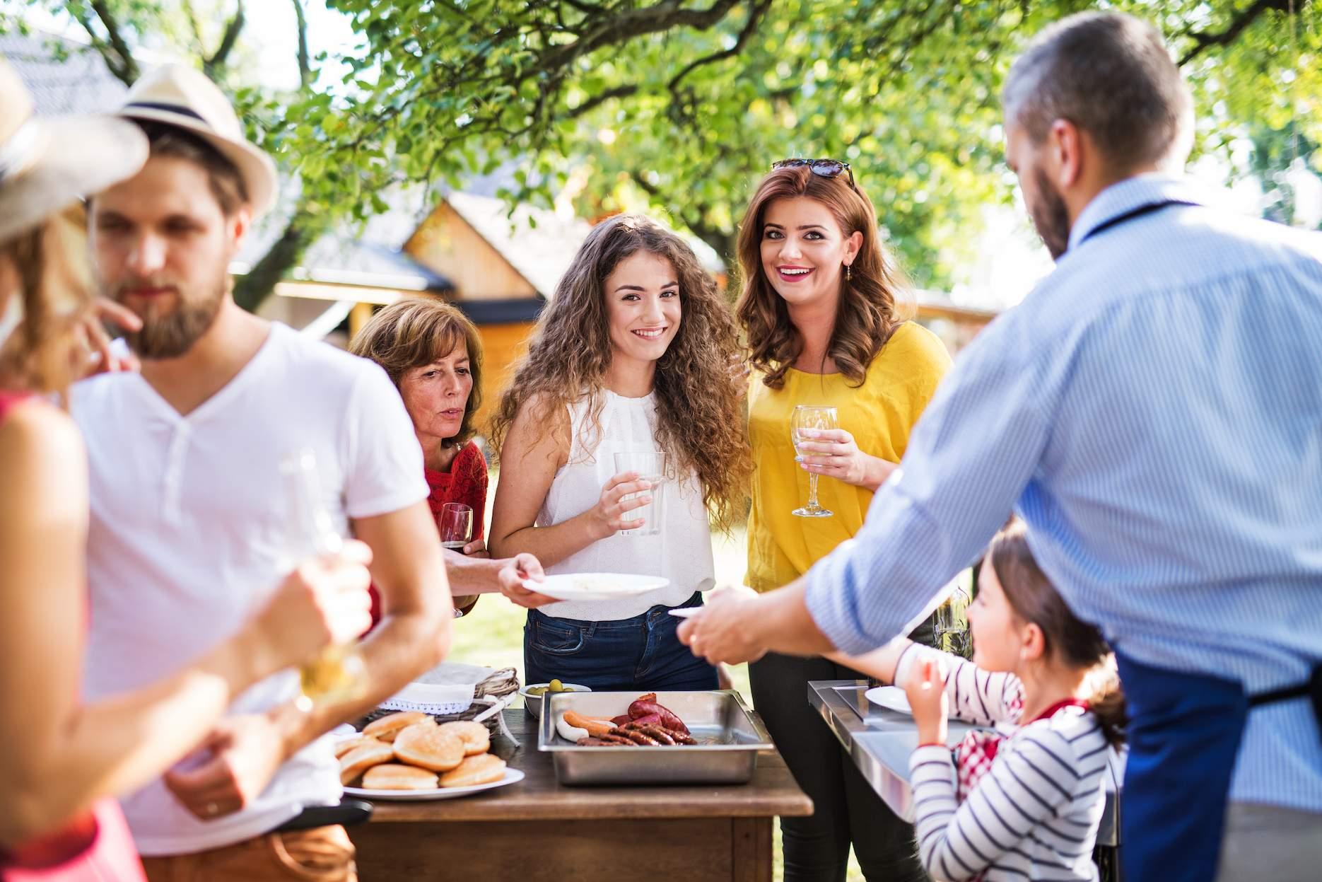 Family-friendly client appreciation event with adults and children outdoors.