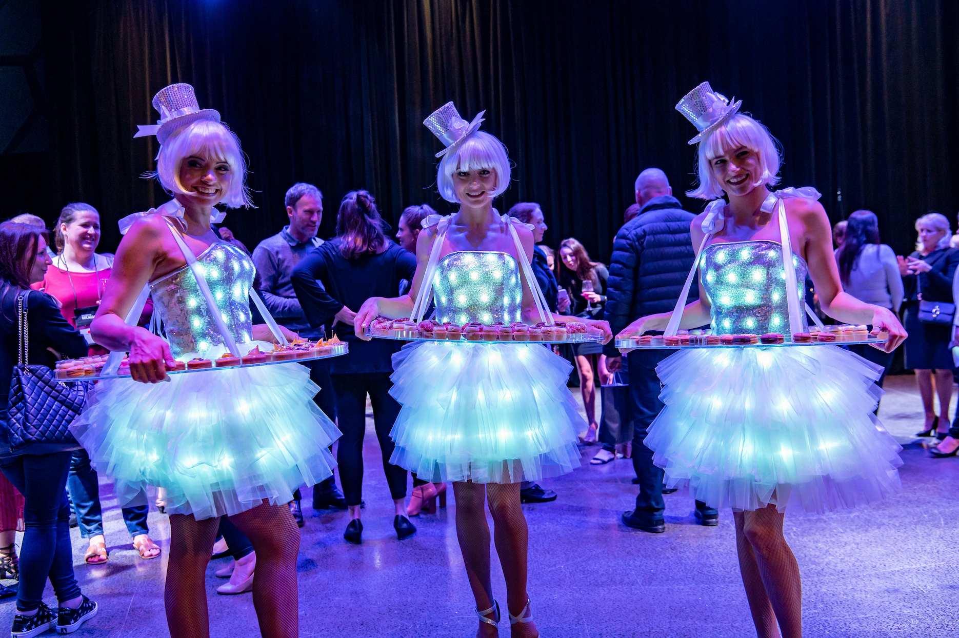 LED roving performers entertaining guests at a corporate event.